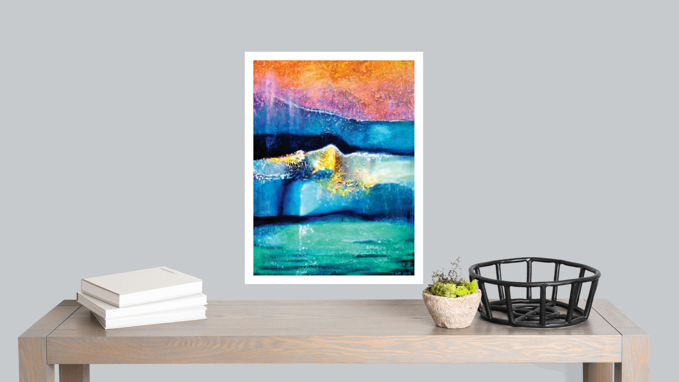 Colorful abstract painting on a wall above a wooden table with books and decor items.