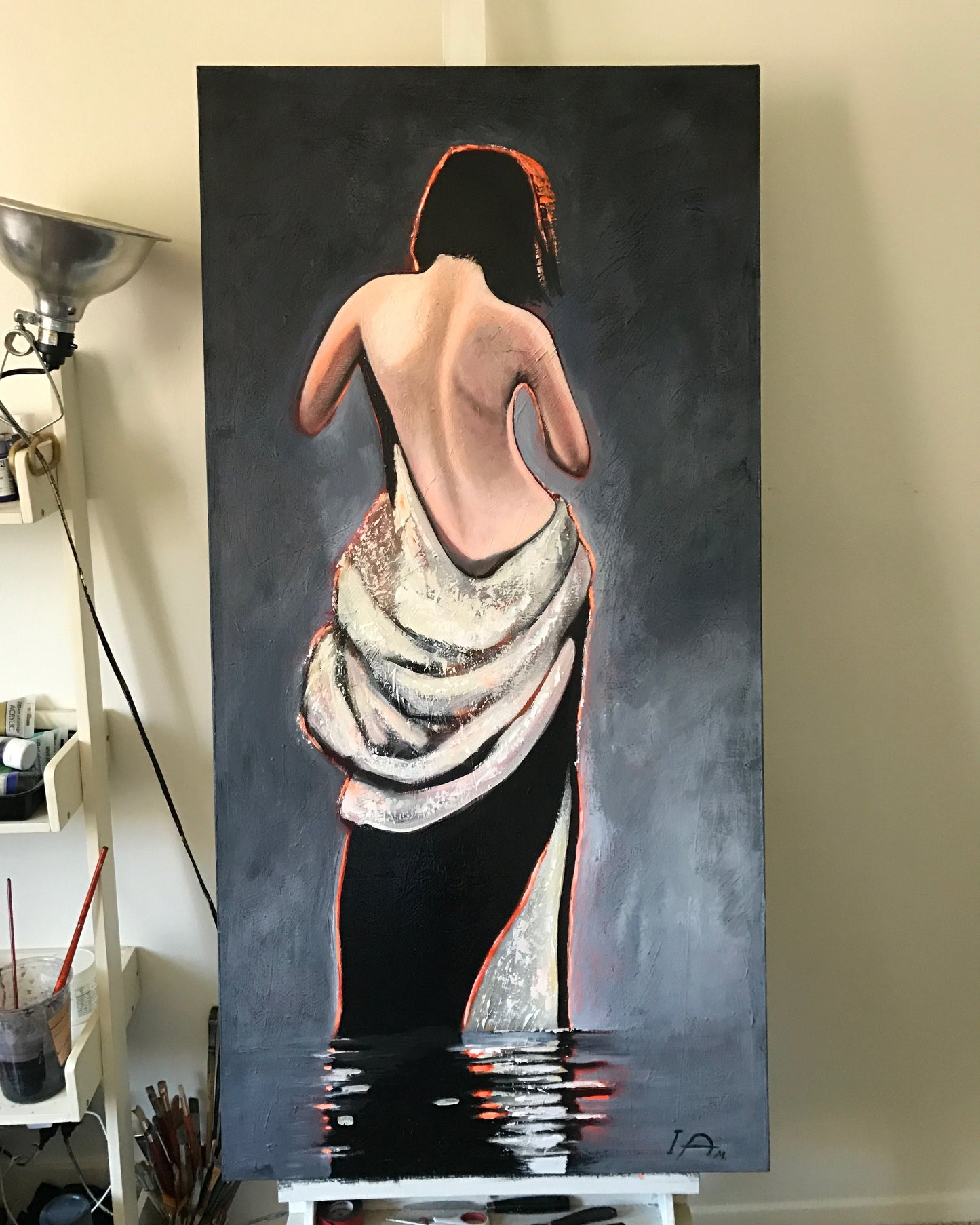 figurative painting of a woman in black white and light in the artist studio
