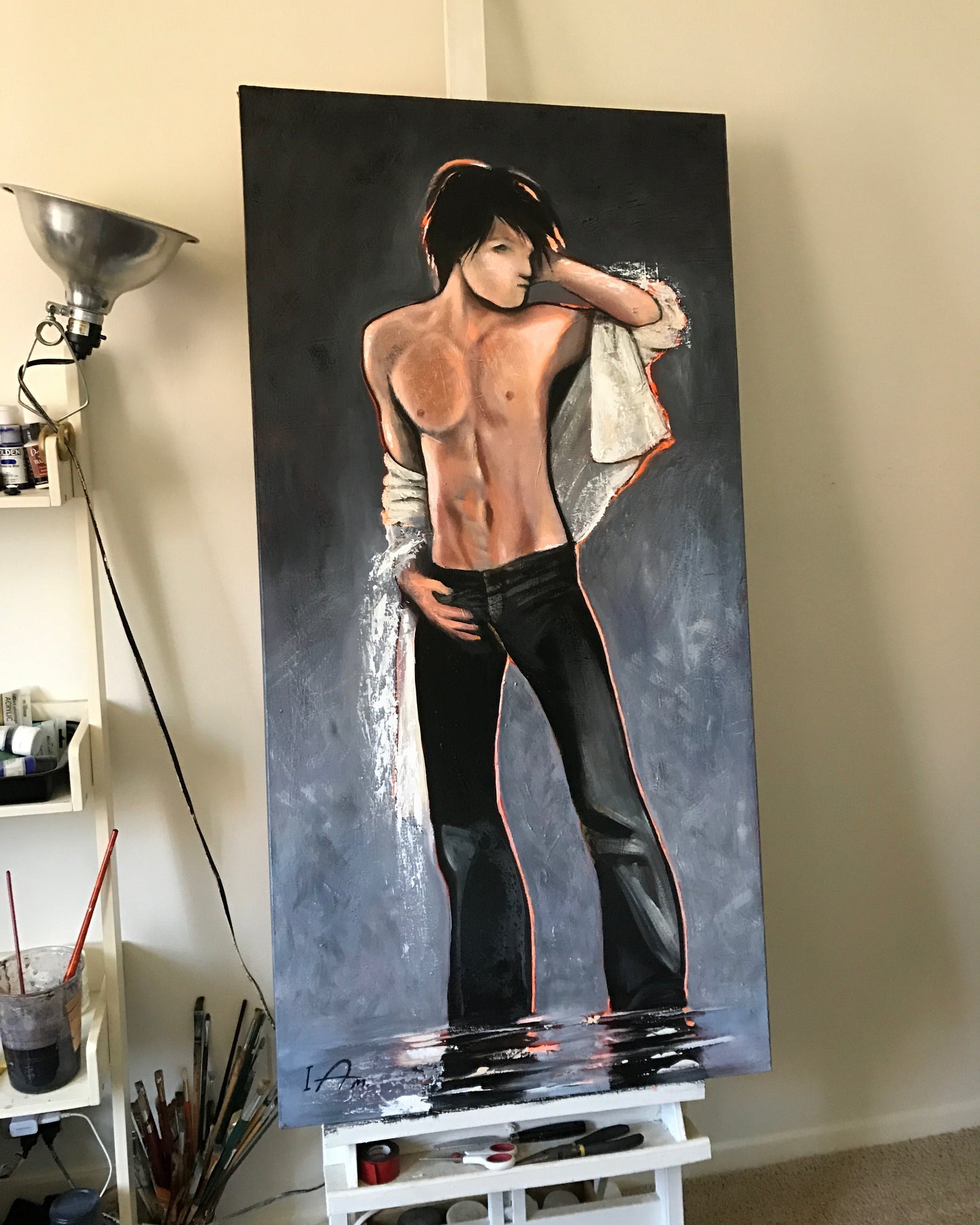 Large painting of a young man in a dynamic pose on a dark background