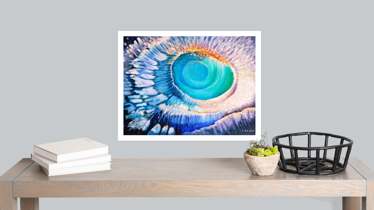 abstract spiral vortex print with white border in blue colors over grey wall