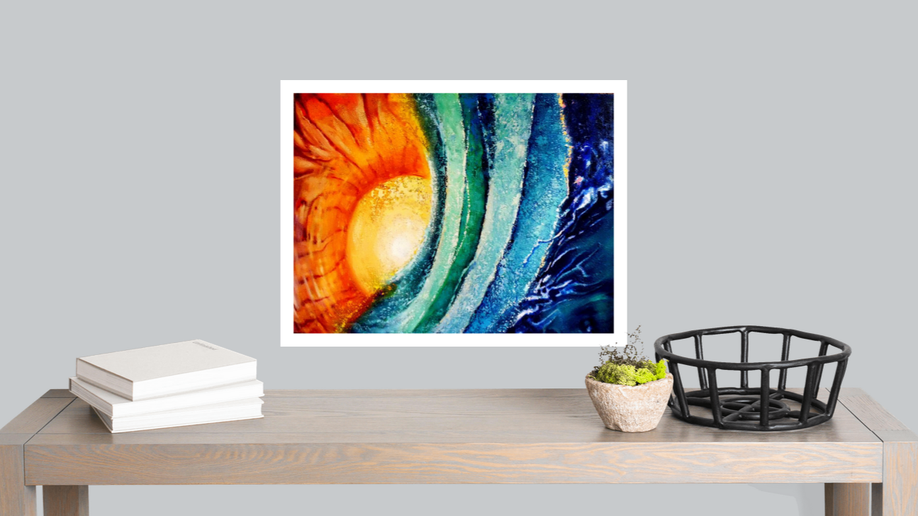Colorful abstract artwork on a wall above a wooden table with books and decor items.