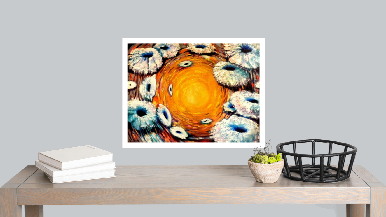 Framed abstract artwork on a wall above a wooden table with decor items.