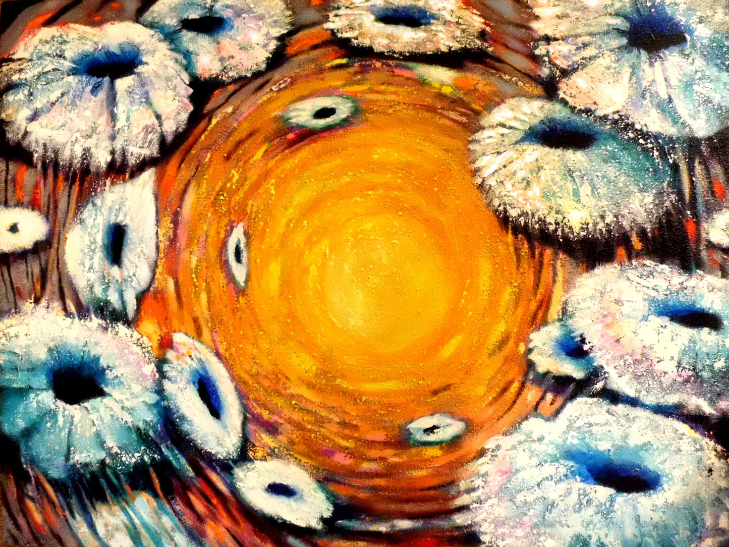 Abstract artwork with a central orange circle surrounded by white and blue circular shapes