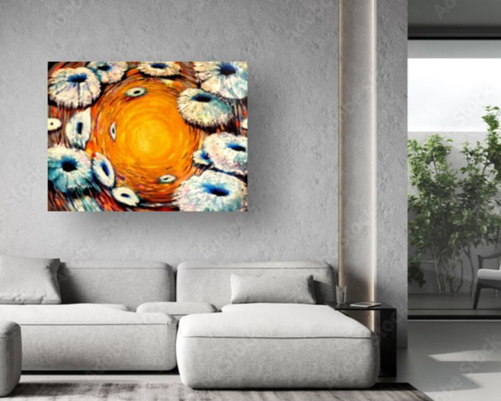 Abstract painting of flowers on a wall above a gray sofa in a modern living room.