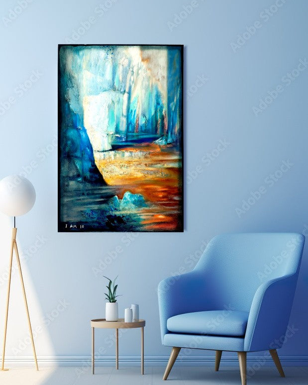 Abstract painting on a wall above a blue armchair in a room with a light blue wall.